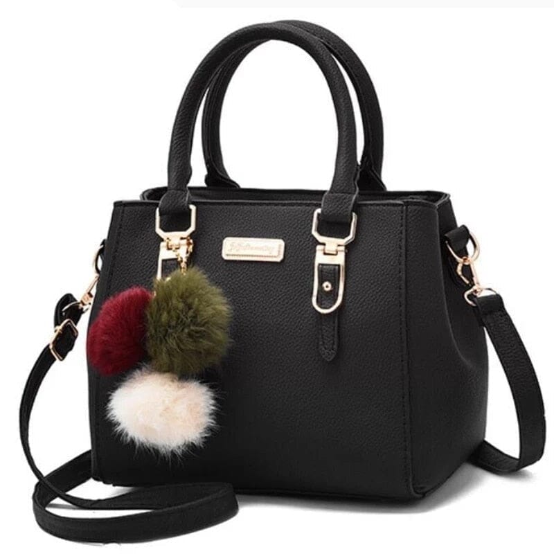 Nora - Schwarze Handtasche mit Pompon-Anhänger