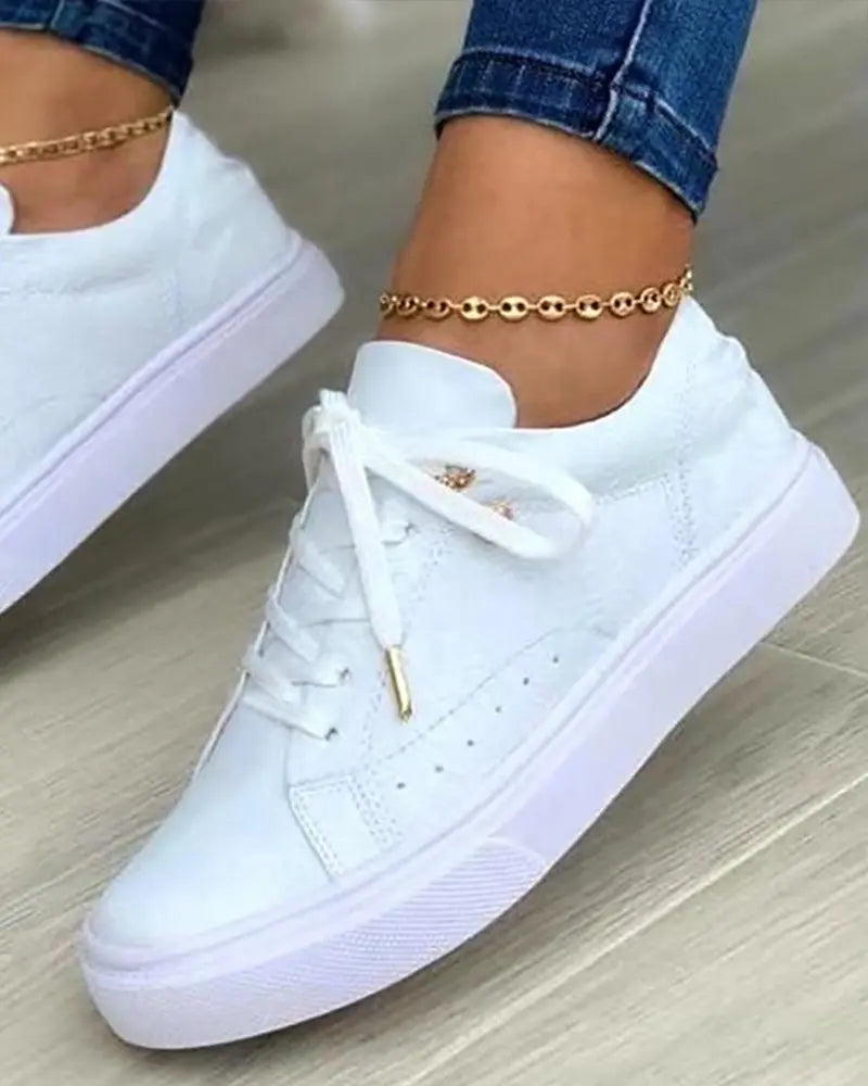Schicke Sneakers mit Gold-Detail